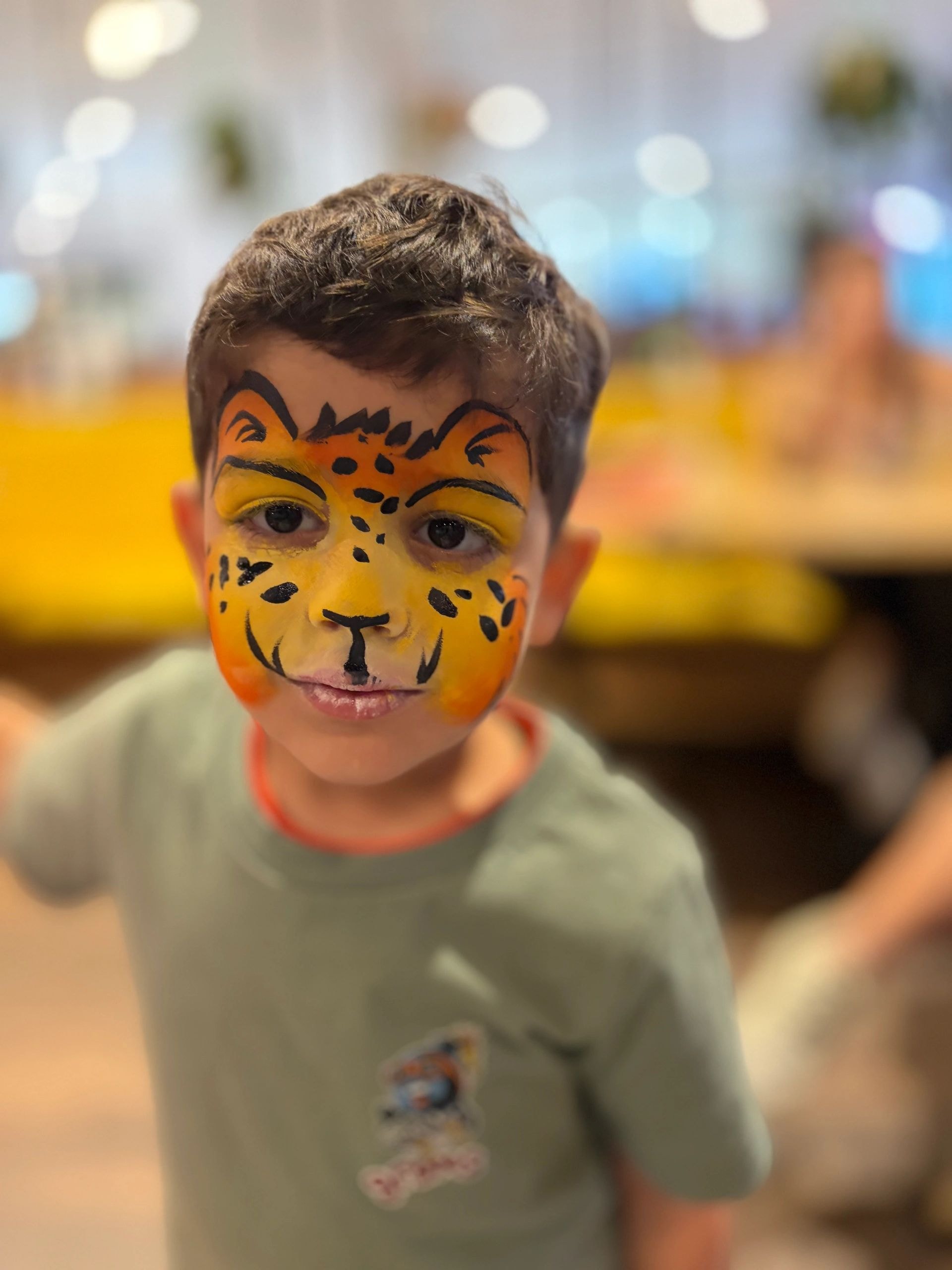 Child with tiger face paint